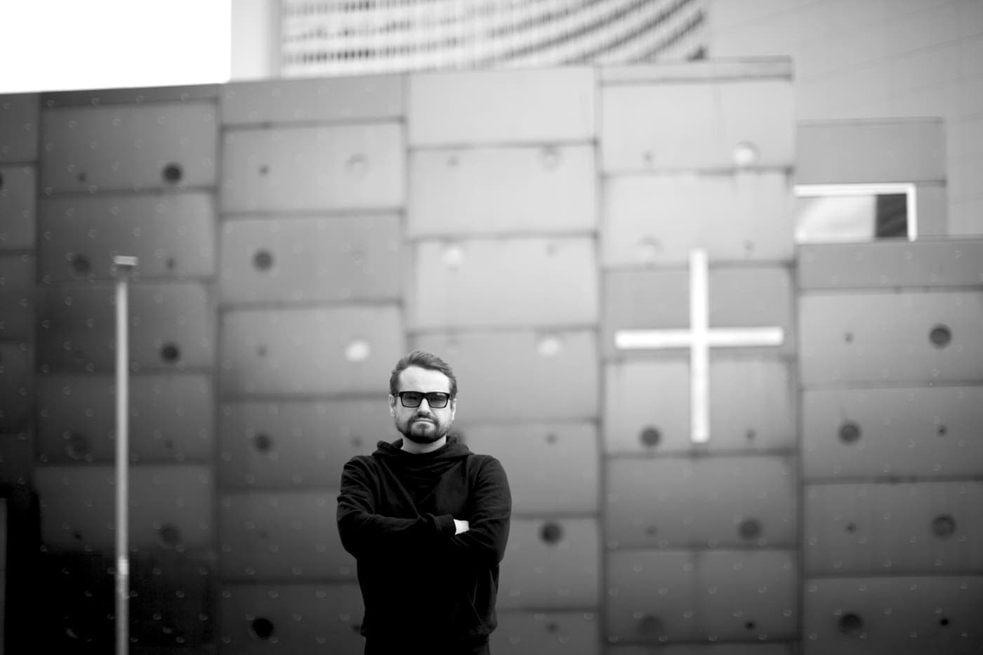 Oldrich Sic Jr. small in frame against a large concrete facade