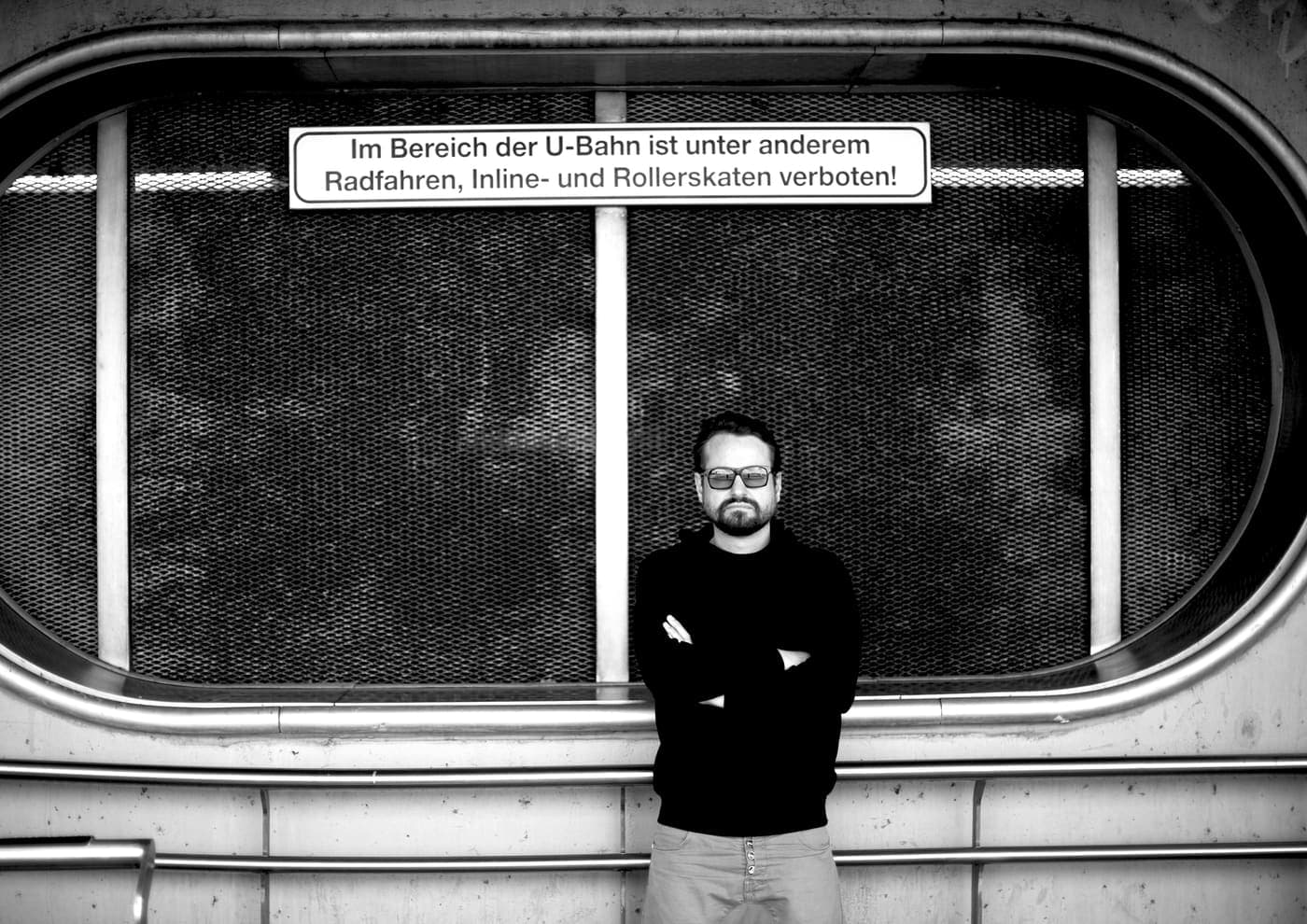 Oldrich Sic Jr. on an underground platform beside a sign