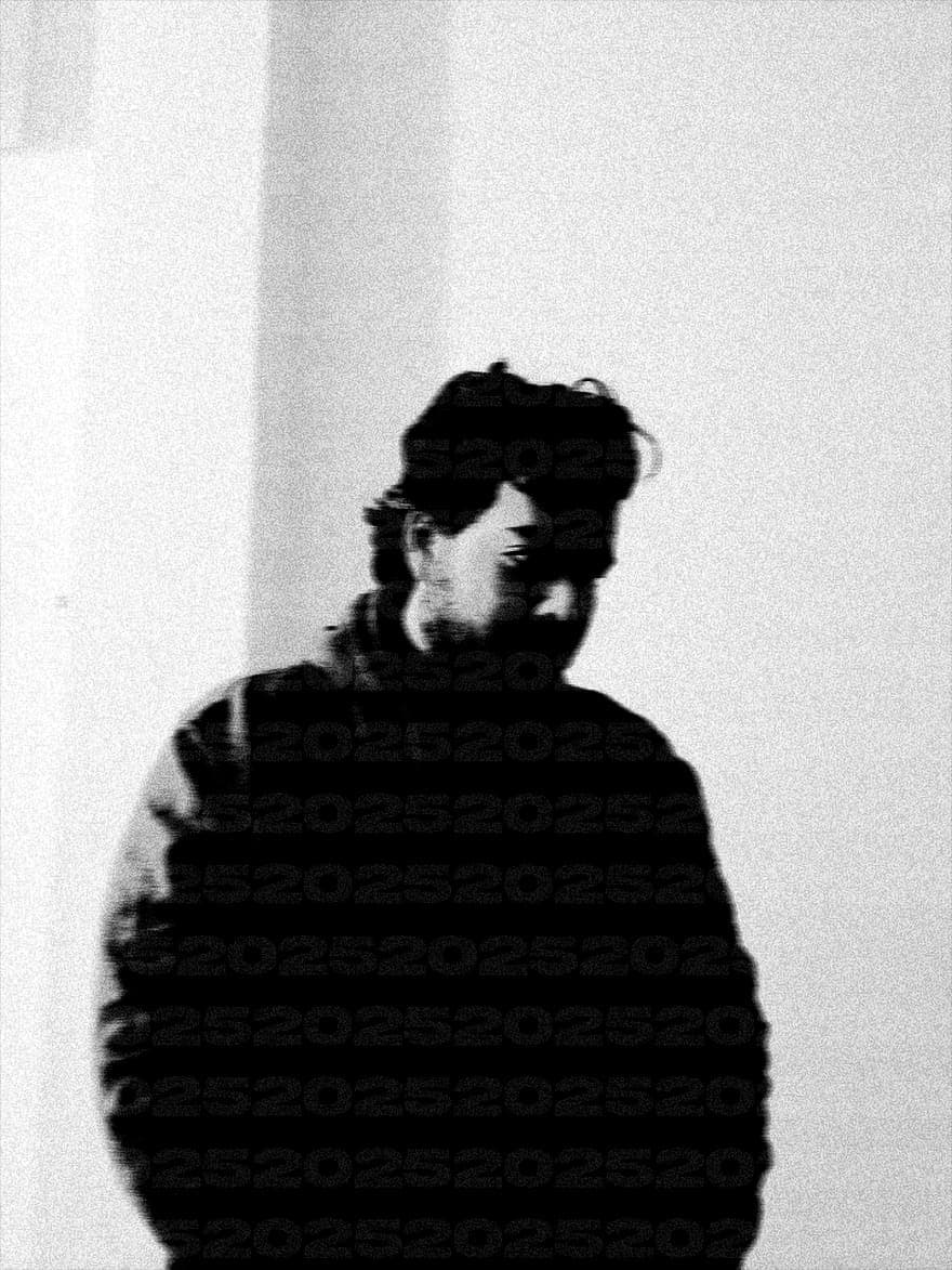 Blurred double-exposure portrait of Ëyris in black and white